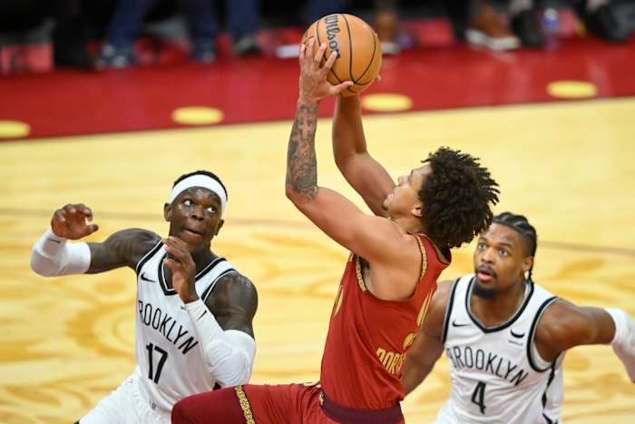 Mar 10, 2024; Cleveland, Ohio, USA; Cleveland Cavaliers guard Craig Porter Jr. (9) drives to the basket between Brooklyn Nets guard Dennis Schroder (17) and guard Dennis Smith Jr. (4) in the third quarter at Rocket Mortgage FieldHouse.